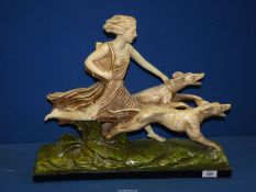 A large chalk figure of Diana Huntress and Hounds, 20 1/2" long x 17" high.