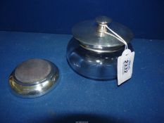 A glass powder bowl with star cut base and Birmingham 1921 silver lid (4" diameter),