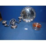 An Arthur Price plated tray (10" diameter), a pierced bottle coaster and a two branch candelabra.