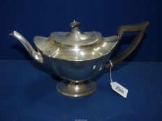 An elegantly shaped Silver Teapot with ebonised handle, London 1903, 607g including handle.