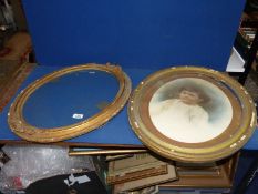 An oval gilt Frame (a/f) 17" x 14", plus one other with a Portrait of a young child (a/f) 20" x 16".