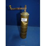 An antique brass coffee/spice grinder, (dent) a/f. 10" tall.