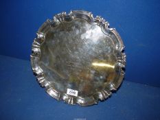 A Sheffield 1919 silver salver on three ball feet,