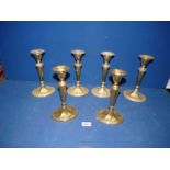 A set of six brass candlesticks, 9" tall.
