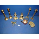 A pair of pierced brass candlesticks of Religious interest stamped Shalom Jerusalem,