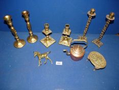 A pair of pierced brass candlesticks of Religious interest stamped Shalom Jerusalem,