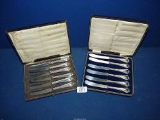 A cased set of silver butter Knives (marks well rubbed), plus another set.