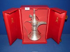 An Islamic silver coffee Pot 'Dallah - Nizwa, Oman', circa 1930 - 1950, in red presentation box.