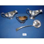 A small quantity of silver plated tableware to include; two sauce boats, a soup ladle, cream jug,