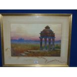 A large framed and mounted Watercolour depicting a Temple on a grassy knoll overlooking a city at