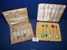 A cased part set of five Silver coffee bean Spoons with coloured enamel to the back of the bowls,