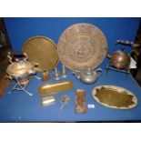 A quantity of brass and pewter to include large charger, brass water kettles, brass trays, bell,