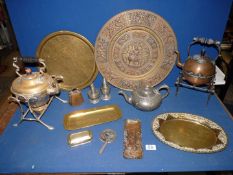 A quantity of brass and pewter to include large charger, brass water kettles, brass trays, bell,