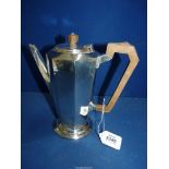 A Silver Art Deco presentation coffee Pot having wooden handle and finial, hallmarks well rubbed.