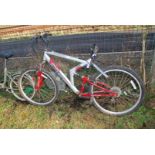 A 12 speed Apollo Gents mountain Bicycle, red and silver.