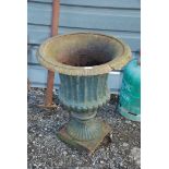 A cast iron urn Planter on square base, 30'' high x 23'' diameter, (slight damage to banding).