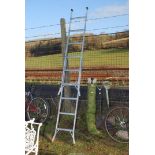 An aluminium extendable six rung step ladder.