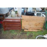 A Pine table, 4' long x 30" wide approx and a shelf unit, and a wooden folding chair.