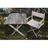 A small slatted table, 27 1/2'' square x 28'' high and a folding director's chair.