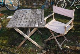 A small slatted table, 27 1/2'' square x 28'' high and a folding director's chair.