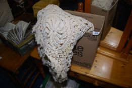 A crotchet/lace table cover.