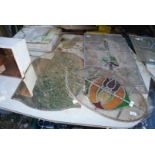 An oval section of coloured stained leaded window plus two sections of leaded stained windows,