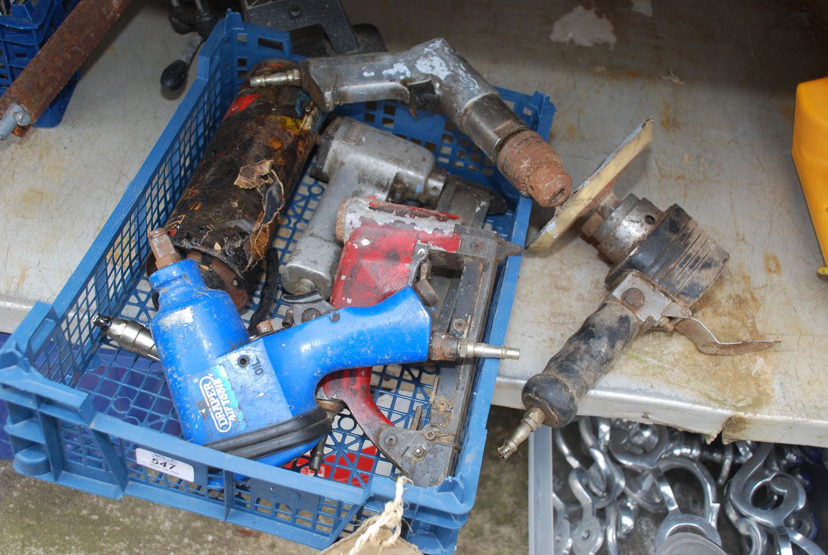 Plastic box of Draper impact wrench, orbital sander, air drill and staple gun.