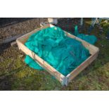 A raised bed and netting, 31'' x 46''.