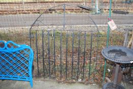 An arched wrought iron Garden Gate, 45'' x 53''.