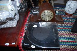 A Record deck and Westminster Napoleon style mantle clock.
