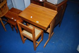A child's school desk and chair.