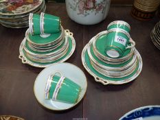 A pretty Teaset in green with narrow floral border including two cake plates,