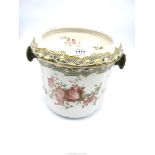 A Royal Doulton 'Burslem' lidded slop bucket decorated with roses, 12" diameter x 10" tall,