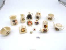 A small quantity of crested Goss ware including pig, tyg, swan, toast rack, teapot, etc.