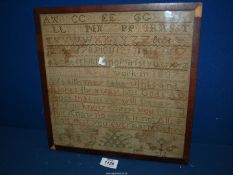 A framed Sampler of a religious passage and letters, no name or date, some staining, 11 3/4" square.
