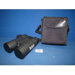 A set of Bushnell PowerView 8x42 Roof Prism Binoculars with 4 caps and original padded case.