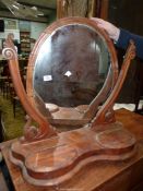 A Satinwood swing Mirror, the base with two hinged lidded trinket compartments,