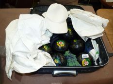 A quantity of bowling equipment in a suitcase including six Greenmaster "Thomas Taylor" bowls, cap,