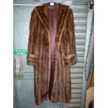 A long two tone fur coat.