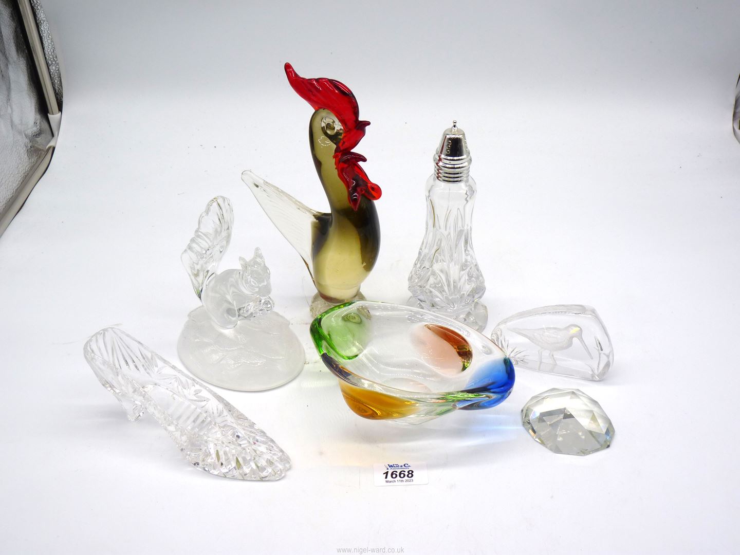 A small quantity of glass including cut glass sugar sifter, multi coloured glass bowls,