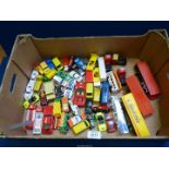 A quantity of play worn Corgi and Matchbox cars and trucks, buses, Royal Mail trucks, etc.