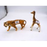 A Beswick Tiger, 9" long and a young Giraffe, 7 1/2" tall,