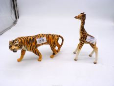 A Beswick Tiger, 9" long and a young Giraffe, 7 1/2" tall,