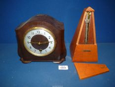 A ''Seth Thomas'' Metronome, 9" tall and a Bakelite mantel clock.