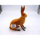 A Beswick Hare, foot has been repaired, model 1025, 7" tall.