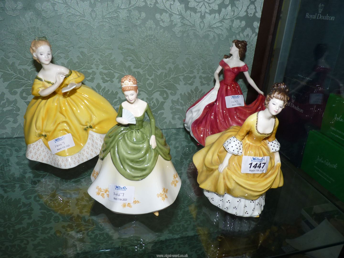 Four Royal Doulton figures 'Coralie', 'Soiree', 'The Last Waltz' and 'Scarlett'.