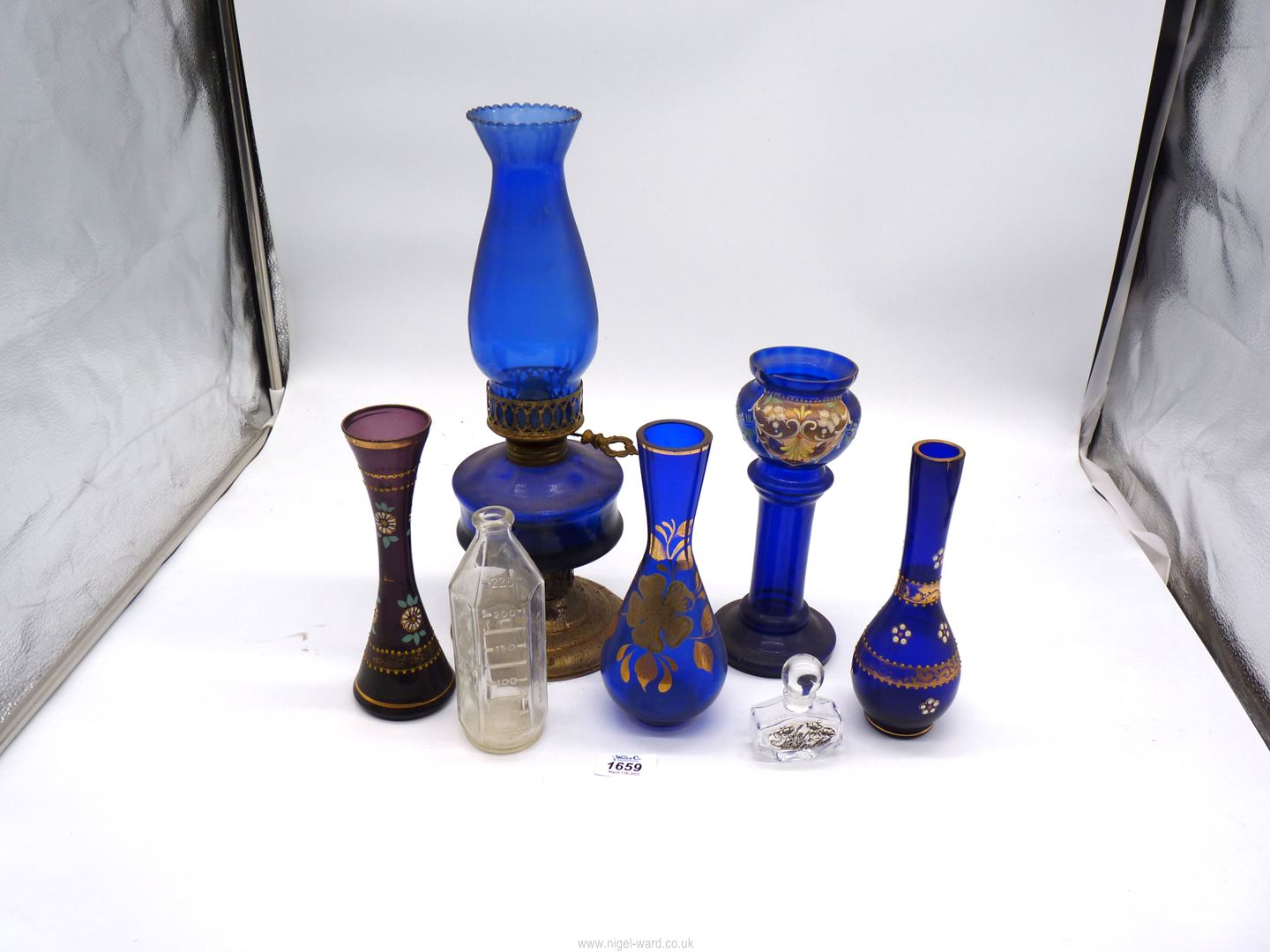 A small quantity of blue glass including painted vases and oil lamp,