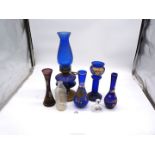 A small quantity of blue glass including painted vases and oil lamp,