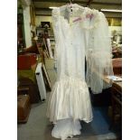 A Benjamin Roberts design Fishtail style Wedding Dress with illusion neckline, long sleeves,