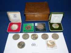 A quantity of Crowns (some cased), plus three 5/- and two £5, all in wooden box.